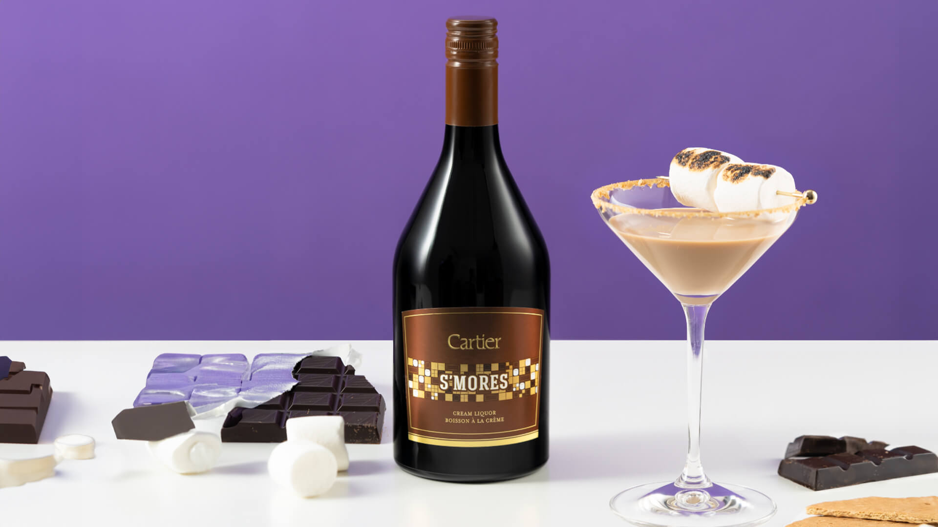 A bottle of Cartier S'mores with a cocktail.
