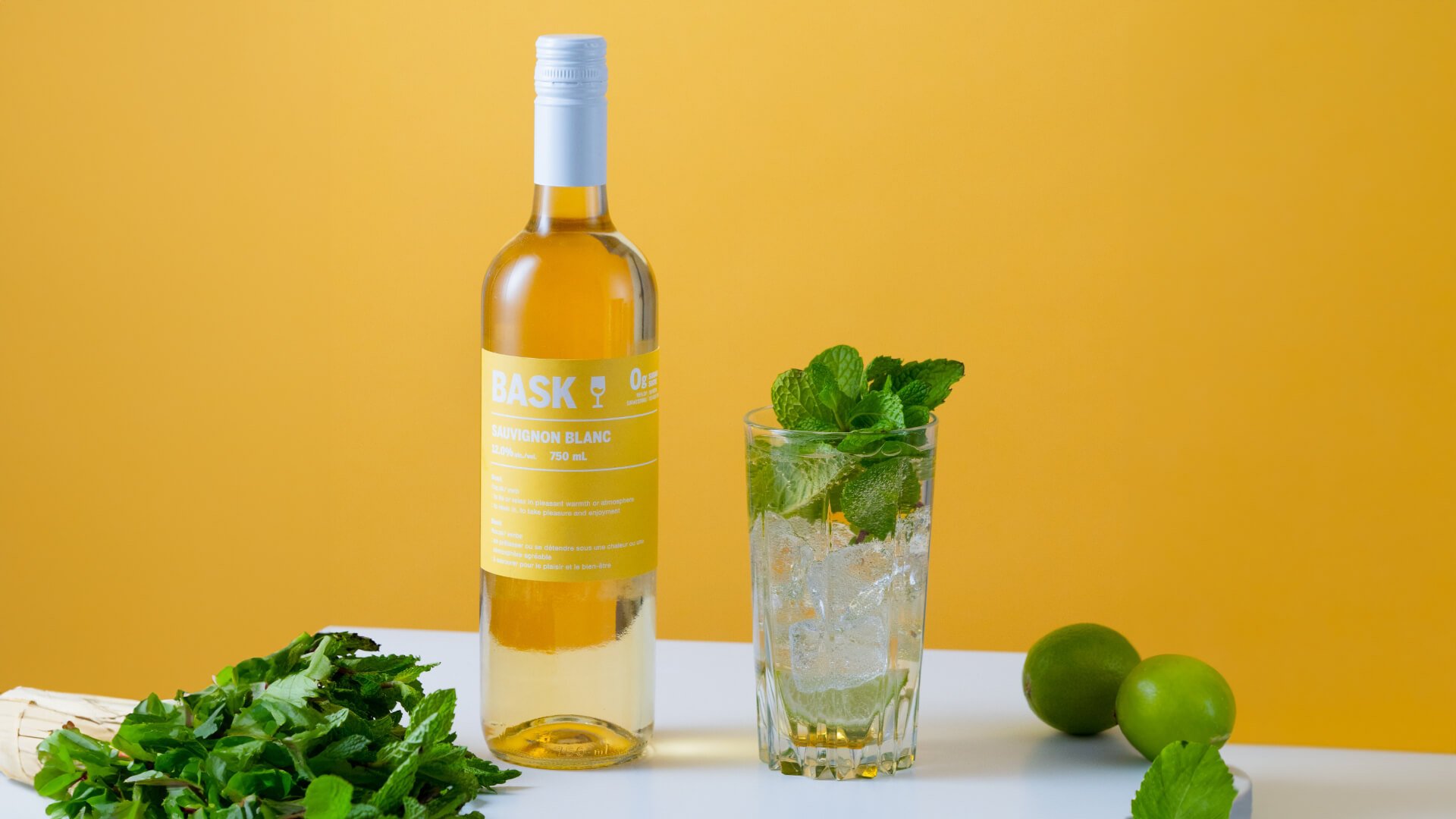 A bottle of Bask Sauvignon Blanc with a cocktail.