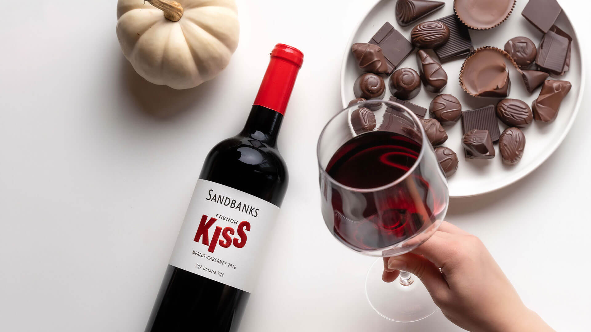 Sandbanks French Kiss Red wine paired with plates of different chocolates.