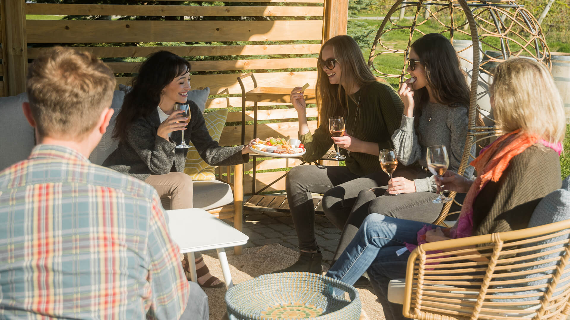  A group of women enjoying a glass of wine at a winery.