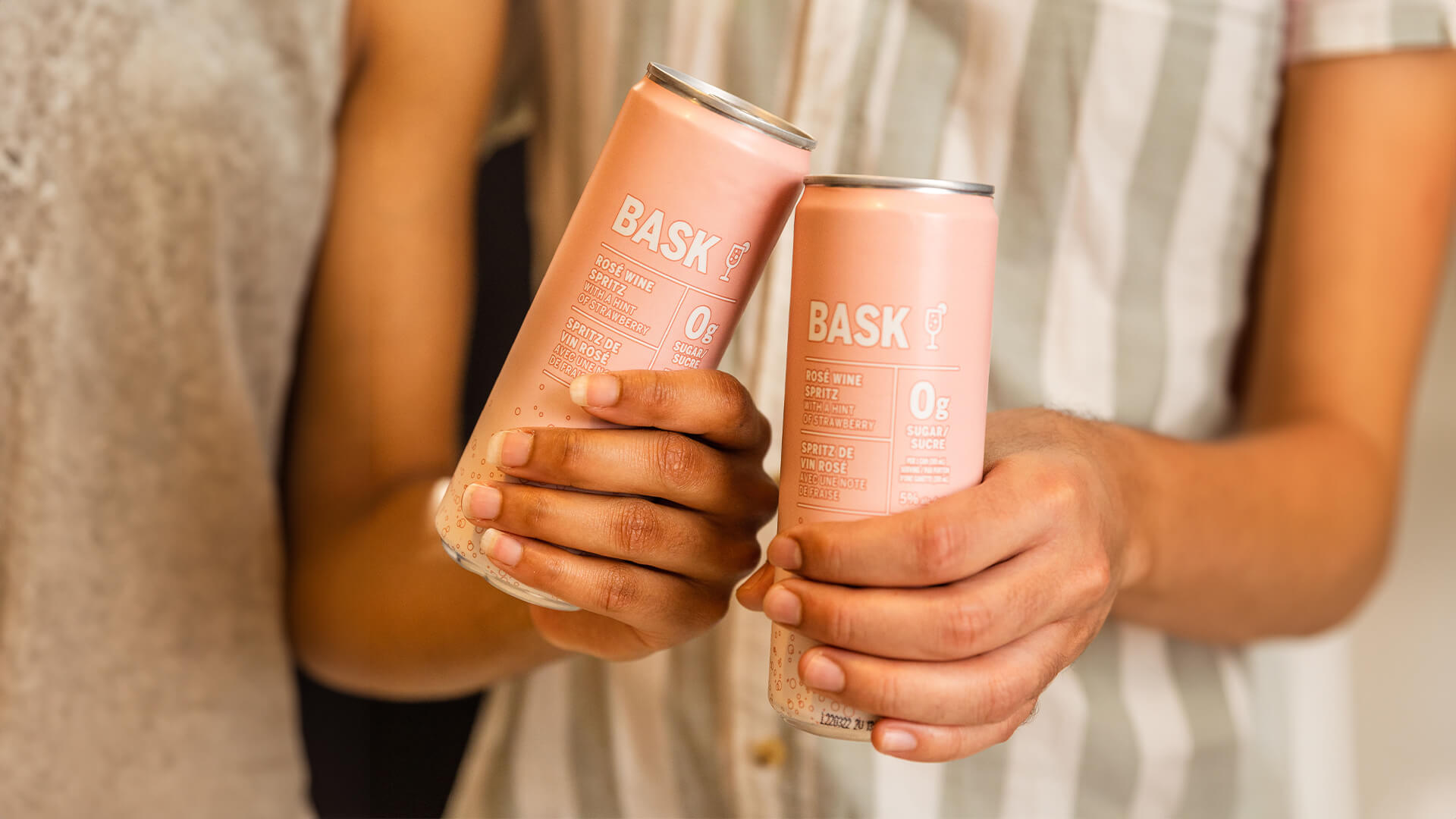 A couple of Bask Rose Wine Spritz cans