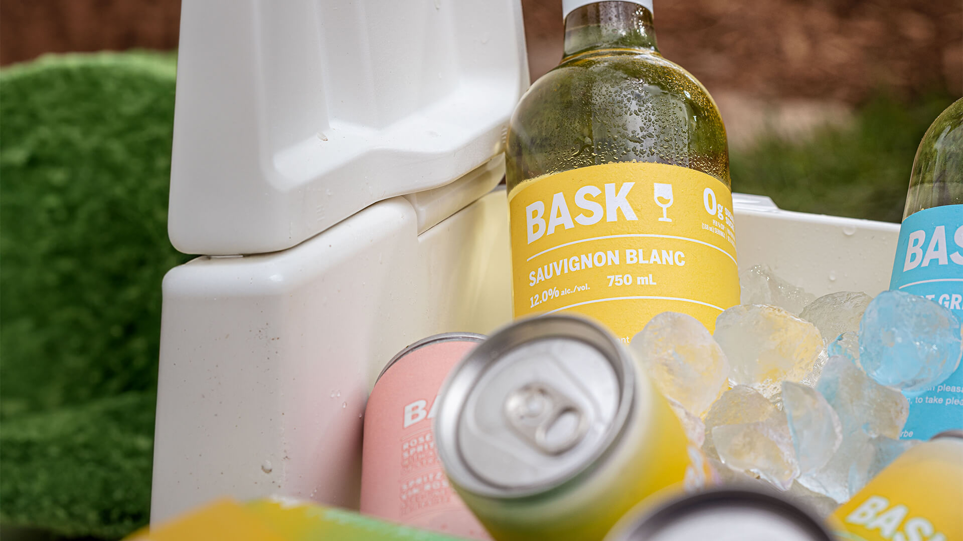 Cooler filled with bottles and cans of BASK wines.