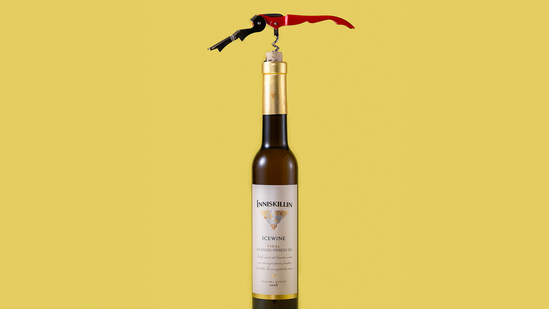 A bottle of Inniskillin Icewine being opened.