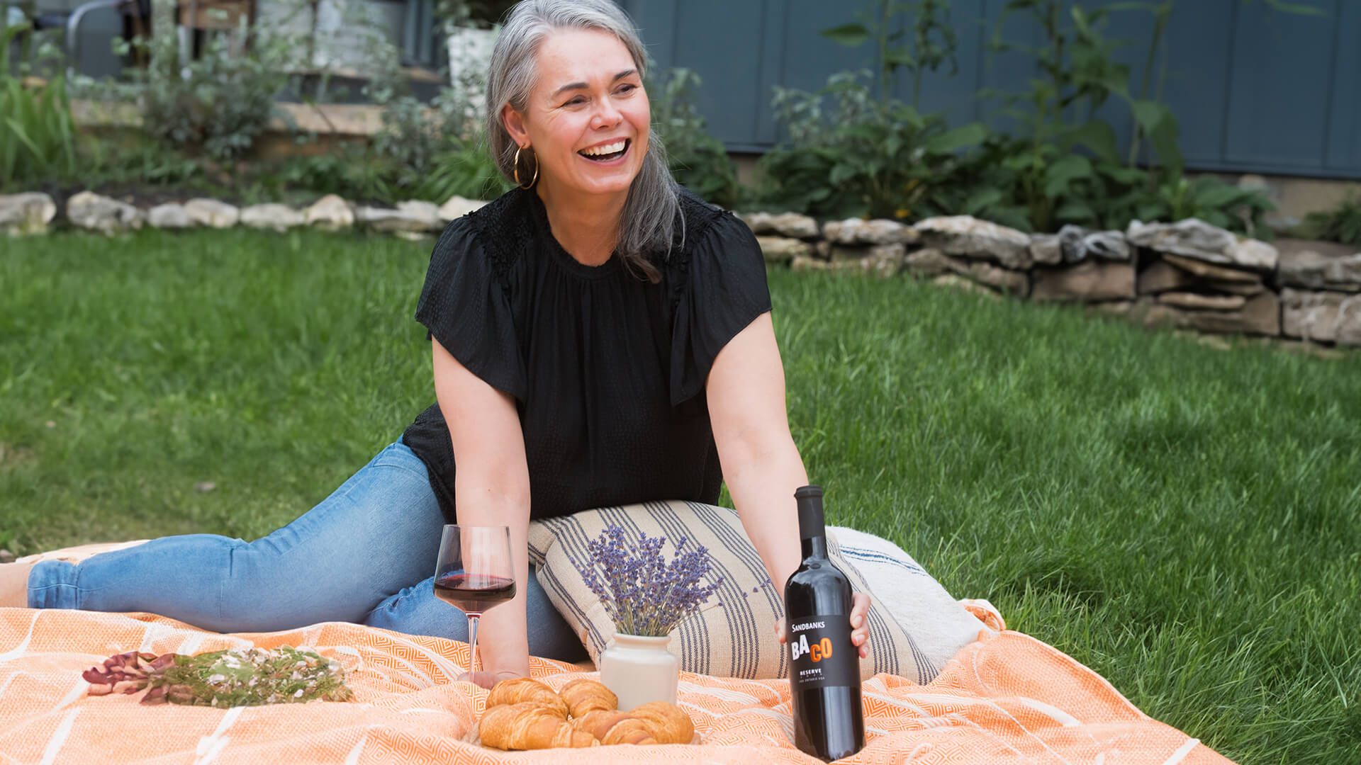 A picnic with a bottle of Sandbanks Baco Noir.