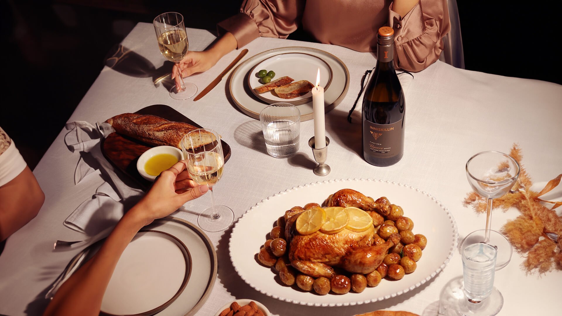 A bottle of Inniskillin on a dinner table.